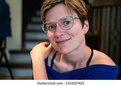 Casual Head And Shoulders Portrait Of A 35 Year Old White Woman Indoors