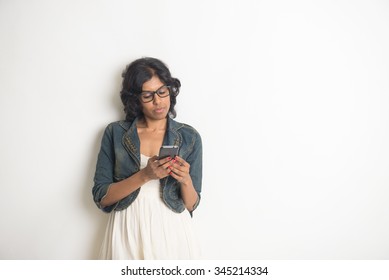 casual indian female listening to music