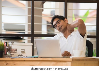 Casual Indian Man Streching At Office