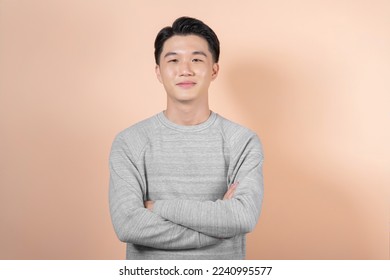 Casual Man with Arms Crossed isolated on beige background - Shutterstock ID 2240995577