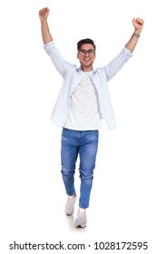 Casual Man With Hands In The Air Is Walking On White Background