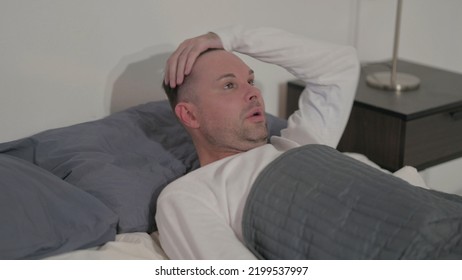 Casual Man Waking Up From Nightmare In Bed