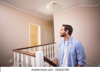 Casual Man Walking Up The Stairs In His New Home