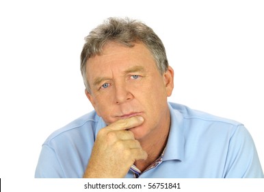 Casual middle aged man with hand on chin with a concerned look.