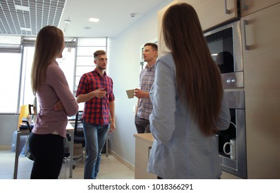 Casual Office People Talking By The Coffee Maker