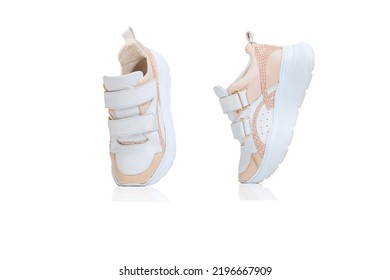 Casual, Peach Colored Sneakers, Shoes Isolated Over White Studio Background. Comfortable Footwear. Concept Of Fashion, Comfort, Style, Shopping, Casual. Copy Space For Ad, Text And Design