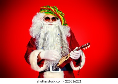 Casual Santa Claus hippie playing ukulele over festive red background.