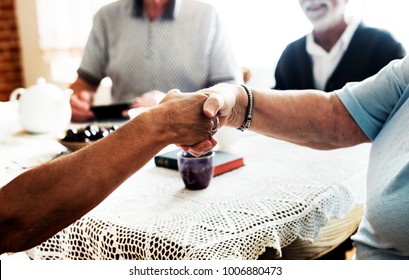 Casual Seniors Shaking Hands