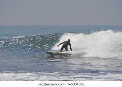 Casual Surfer In Wetsuit | Laid Back Waves