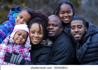 Casual Winter Young Black Family Outdoors In The Park