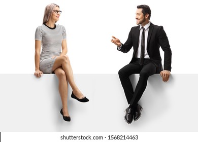 Casual Woman And A Businessman Sitting On A Panel And Talking Isolated On White Background