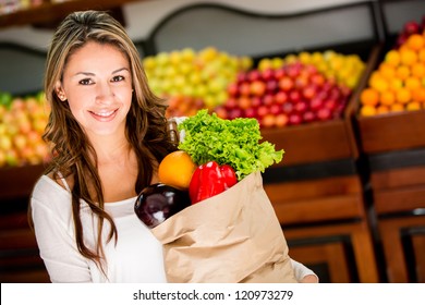 Casual Woman Grocery Shopping And Looking Happy