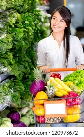 Casual Woman Grocery Shopping At The Supermarket