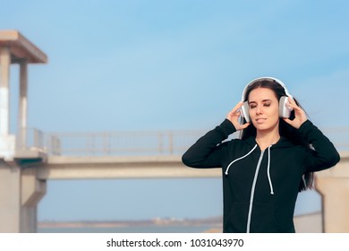 Casual Woman Listening to Music on Her Headphones and Relaxing
Beautiful girl with headset listening her favorite song with her eyes closed
 - Powered by Shutterstock