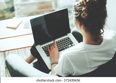 Casual Woman Manager Sitting In Her Office Workspace With Computer And Big Bright Window