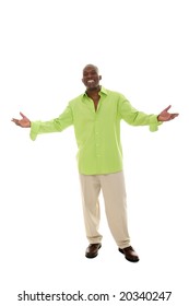 Casual Young African American Man Standing In A Bright Green Shirt With A Welcoming Hands Apart Gesture.