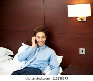 Casual Young Man Talking To His Girl After Long Work Day. Relaxing In His Lavish Hotel Room