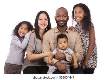 casual young mixed family on white isolated background