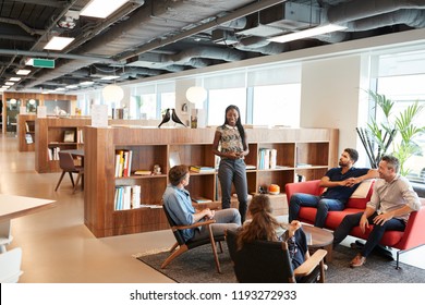 Casually Dressed Businessmen And Businesswomen Having Informal Meeting In Modern Office - Powered by Shutterstock
