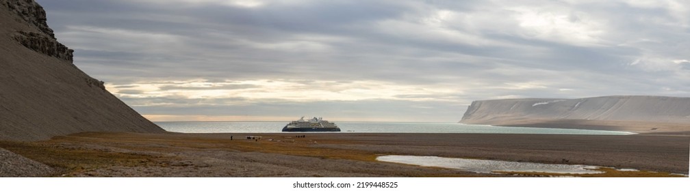 Caswell Tower, Devon Island, Nunavut, Canada - August 22, 2022 :  Lindblad's National Geographic Endurance At Caswell Tower In Radstock Bay, Devon Island, Nunavut, Canada.