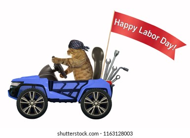 The cat in a bandana is driving a blue car with a red banner " happy labor day ". White background.
