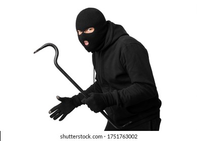 Cat Burglar Concept. Portrait of sneaky masked criminal holding crowbar, copy space, isolated over white studio wall