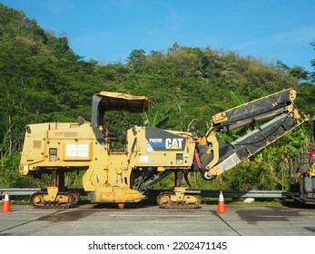 CAT Cold Planer PM200 Series. Excavating Machinery. Summer View At Outdoor. There Is Unfocus Vehicle.