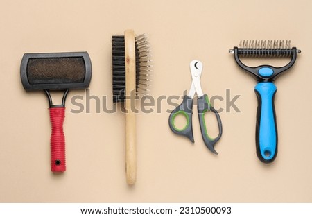 Cat and dog grooming brush and nail clippers, top view Foto d'archivio © 