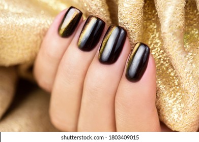 Cat Eye Nail Art. Manicure Golden Brown On A Gold Background