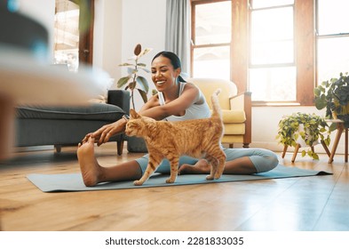 Cat, fitness or happy woman in yoga stretching legs for body flexibility, wellness or healthy lifestyle. Kitten, pet animal or zen girl in exercise, workout or training warm up in house exercising - Powered by Shutterstock