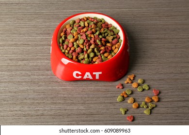 Cat Food In Bowl On Wooden Background