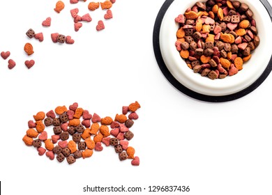 Cat Food. Dry Food In Shape Of Fish, Bowl With Food On White Backgorund Top View Copy Space