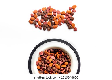 Cat Food. Dry Food In Shape Of Fish, Bowl With Food On White Backgorund Top View Copy Space