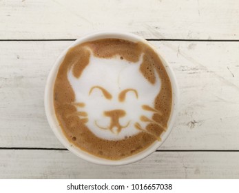 Cat Latte Art Of Hot Coffee On Wood Table.