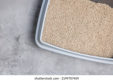 Cat litterbox with natural flushable biodegradable refined active wood pellet as clumping litter. Eco-friendly product for indoor pets. Top view, copy space - Shutterstock ID 2199707459