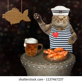 The Cat Seaman Is Drinking Beer And Eating Shrimp In The Bar.