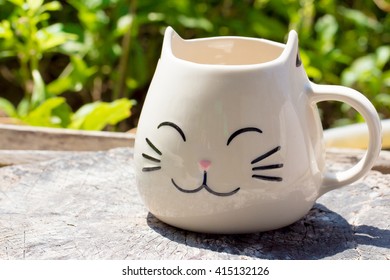 Cat Shape Mug On Wooden Table Outdoor 