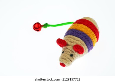 Cat Toy Mouse. Made Of Colored String, With A Green Tail Ended With A Bell. White Background, Isolated.