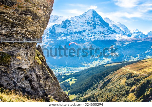Cat walk round the First cable\
car top station over snowy Alps  above Grindelwald,\
Switzerland.