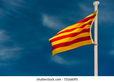 Catalan flag on pole is blowing in the wind