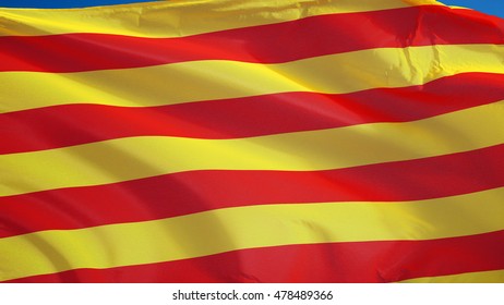 Catalunya flag waving against clean blue sky, close up, isolated with clipping path mask alpha channel transparency