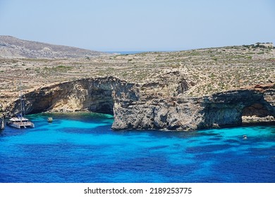 Catamaran On Crystal Lagoon On European Comino Island In Malta