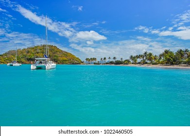 Catamaran on turquoise sea near Mayreau Island, Caribbean Sea