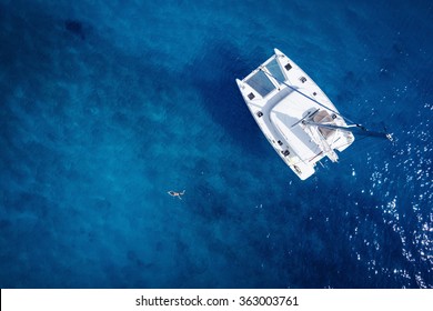 Catamaran in open sea - aerial / drone view