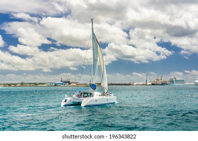 Catamaran Sailing Off The Coast Of Barbados On A Cloudy Day