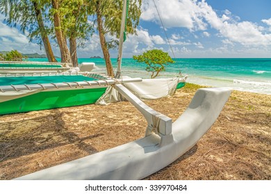 A Catamaran Sitting At The Shore Of Waimanalo Bay On Oahu, Hawaii