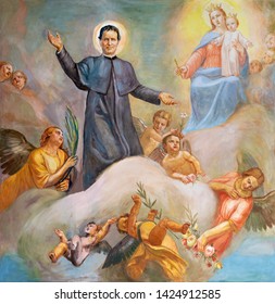 CATANIA, ITALY - APRIL 8, 2018: The painting of Don Bosco and Mary Help of Christians in the church Chiesa di San Filipo Neri by Giuseppe Barone (20. cent.).