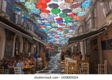 Catania Sicily Italy 2019 Street Art Decoration Using Umbrellas At The Fish Market, Colorful View With People Enjoying The Food At Restaurants