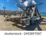 Catapult from the Muralla del Carme or Catapulte bastioni Cristoforo Colombo on fortified walls, one of the medieval catapults on the Bastioni Marco Polo, Alghero, Sardinia, Sassari, Italy.