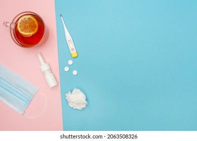 Catch A Cold. Flu Season. Disease. Flat Lay. Medical Mask, Pills, Nasal Spray, Used Wipes, Thermometer, And Lemon Tea. Place For Your Text. Copy Space. Mockup. Seasonal Cold Concept. 